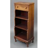 A mahogany small waterfall bookcase by CARL FORSLUND, MICHIGAN, USA, fitted frieze drawer above