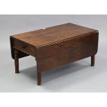 A mahogany rectangular drop-leaf low coffee table fitted end drawer, & on ring-turned legs, 35¼”