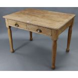 A pine kitchen table with rectangular top, fitted two frieze drawers, &on four turned legs, 42” wide
