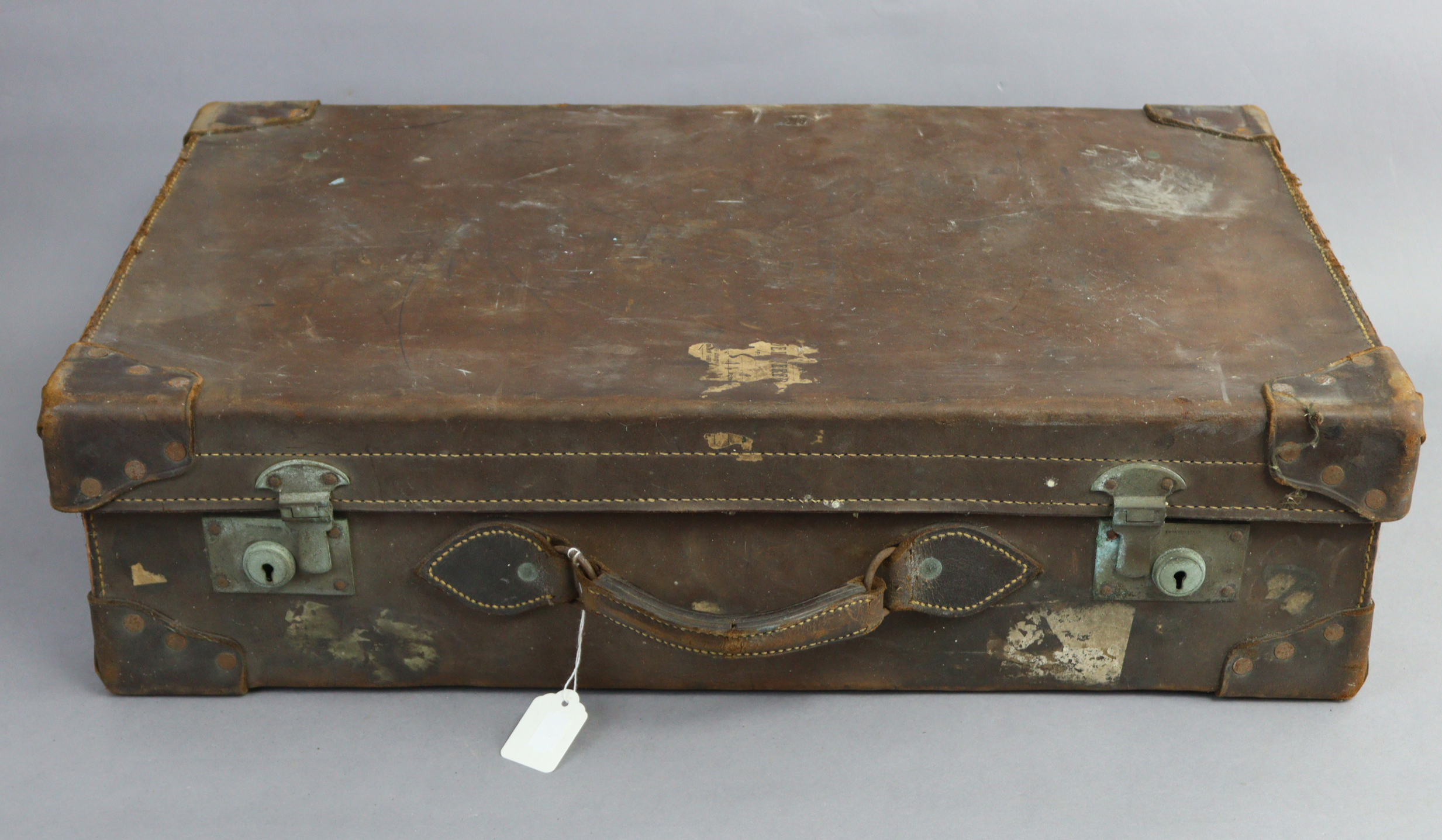 An early-mid 20th century fibre-covered & leather-bound suitcase, with chrome twin-lever locks, 26½”