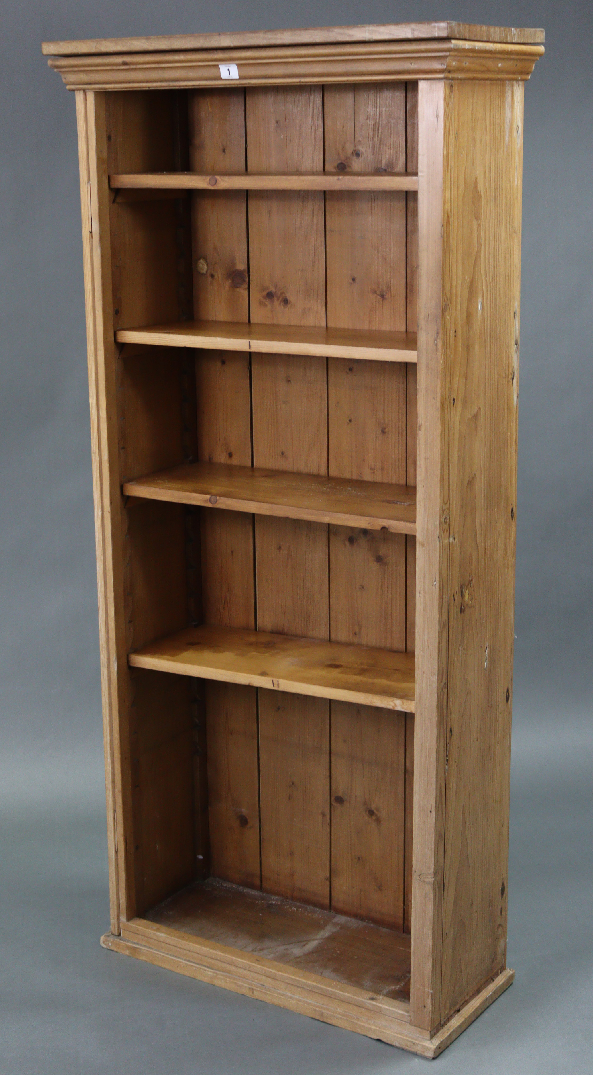 A pine tall standing open bookcase with four adjustable shelves, 28” wide x 61¼” high.