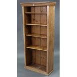 A pine tall standing open bookcase with four adjustable shelves, 28” wide x 61¼” high.