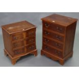 A reproduction yew wood small chest, fitted four long drawers with brass swing handles, & on