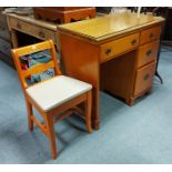 A walnut-finish sewing machine table (lacking sewing machine), with rectangular top & fitted three