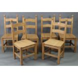 A set of six hardwood rail-back dining chairs with hard seats, & on square legs with plain