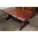 A CHERRY WOOD REFECTORY TABLE, with rectangular top & on shaped end supports joined by plain