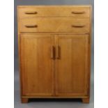 A mid-20th century light oak tallboy, fitted two long graduated drawers above cupboard enclosed by