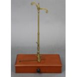 A set of early 20th century brass portable beam scales with numerous weights, & fitted with a long