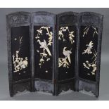 An early-mid-20th century Japanese carved hardwood small folding screen, with inlaid decoration of