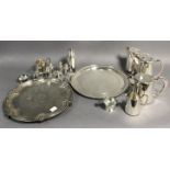 A Victorian engraved silver-plated salver, 13¾” diameter; a silver plated circular two-handled tea