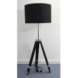 An ebonised wooden rectangular low coffee table on square tapered legs, 34” wide; & a tripod-style