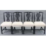 A set of four Chippendale-style splat-back dining chairs with padded seats, & on moulded square legs