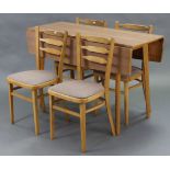 A laminate rectangular drop-leaf kitchen table on four round legs, 46½” wide; & a ditto set of