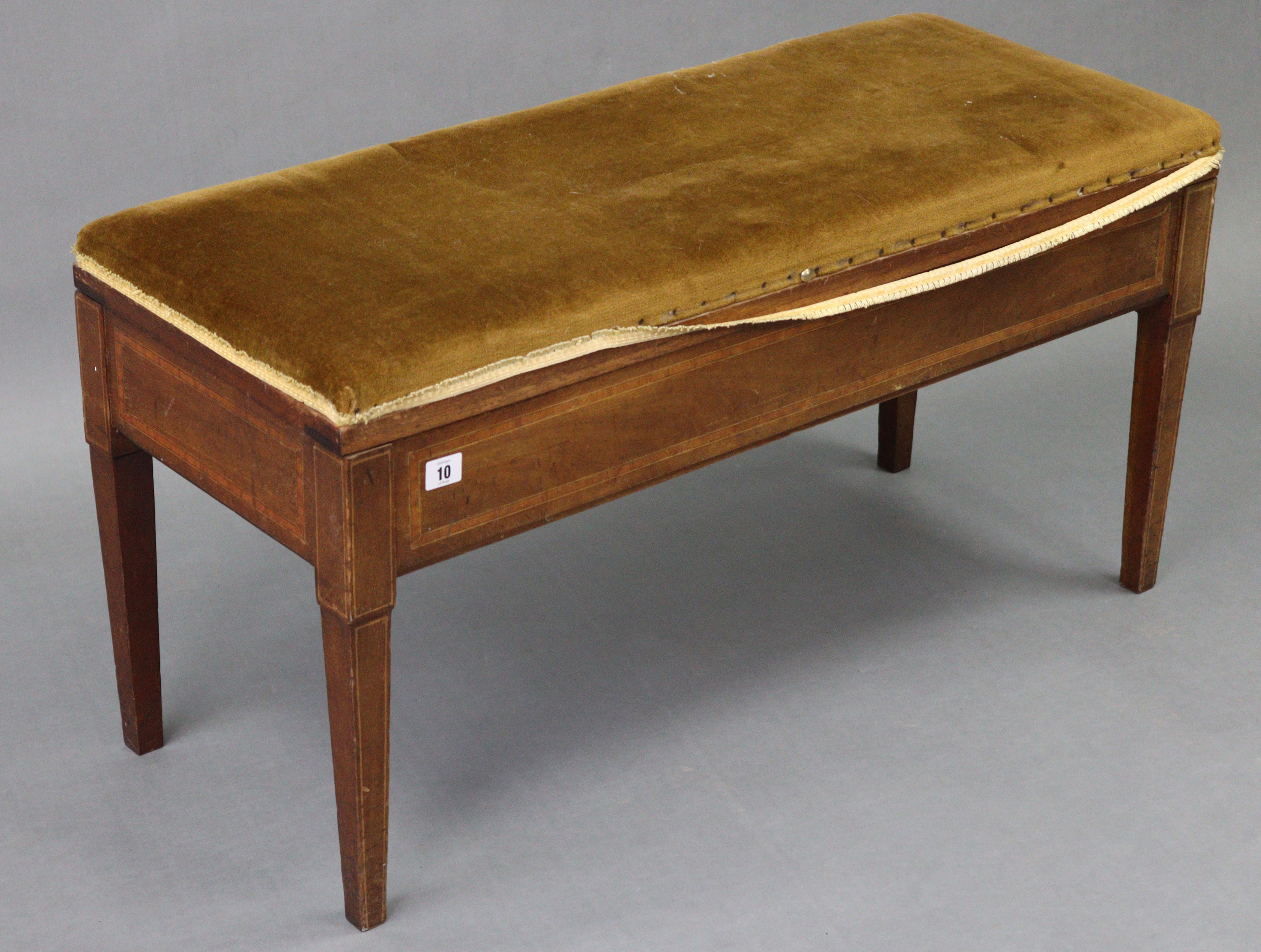 An Edwardian inlaid mahogany “duet” piano stool with padded hinged seat, & on four square tapered