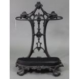 A Victorian-style black painted cast-iron umbrella stand, 27½” high.