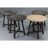 A set of four oak pub tables, each with circular top & on four baluster turned legs with diagonal