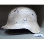 A German Third Reich Wehrmacht winter helmet from the ET Eisenthule works,