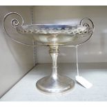 An Edwardian silver twin handled tazza, the shallow dish with a raised,