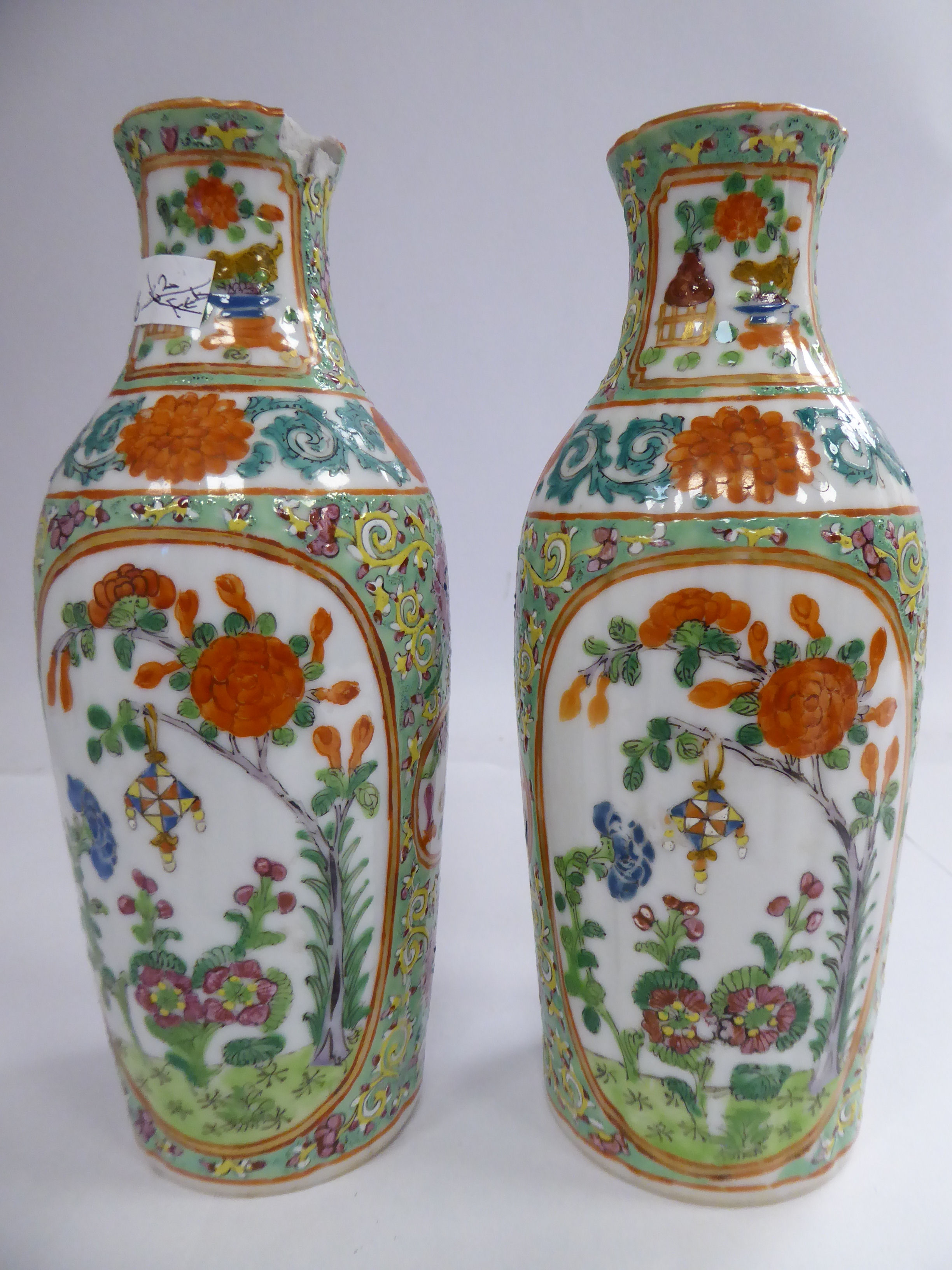 A pair of late 19thC Chinese porcelain vases of oval slender form,