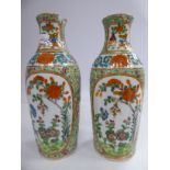 A pair of late 19thC Chinese porcelain vases of oval slender form,