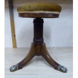 A Regency mahogany framed music stool, the height adjustable, overstuffed,