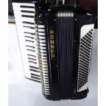 A Hohner Verdi III piano accordian, in a black,