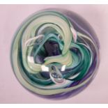 A Whitefriars domed glass paperweight with swirling multi-coloured ornament 3.