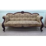 A late Victorian scrolled and moulded mahogany showwood framed settee,