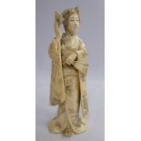 A late 19th/early 20thC Japanese carved and engraved ivory figure,
