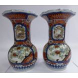 A pair of early 20thC Japanese Imari porcelain vases, each with a petal design flared lip,