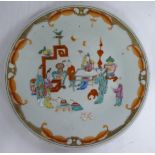 A late 19thC Chinese porcelain plate, decorated with figures seated and standing around a table 10.