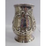 A Georgian style silver mug of baluster form, having a hollow, acanthus looped,