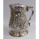 A George III silver mug of baluster form, having a hollow, acanthus topped,