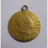 A George III half-guinea, the Royal Standard on the obverse (rubbed),