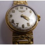 A lady's Longines 9ct gold round cased and textured bark effect, flexible link bracelet wristwatch,