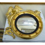 A late 19thC giltwood convex mirror,
