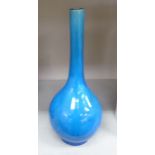 An early 20thC Chinese drip glazed, turquoise porcelain bottle vase with a long, narrow neck 14.