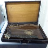An early 20thC rosewood cased zither boxed CA