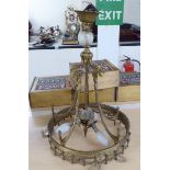 A mid 20thC 'antique' inspired hanging centre light with draped ribbon ornament 21''drop 17''dia