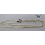 A double row graduated pearl necklace,
