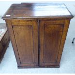 A late 19thC mahogany low cupboard with a pair of doors, on a plinth 32.