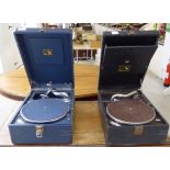 A mid 20thC HMV portable gramophone, in black casing; and a slightly later model,
