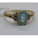 A 10ct gold claw set topaz and diamond ring 11