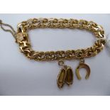 An 18ct gold double ring link bracelet,