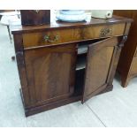 An early Victorian mahogany chiffonier, the single drawer with brass bail handles,