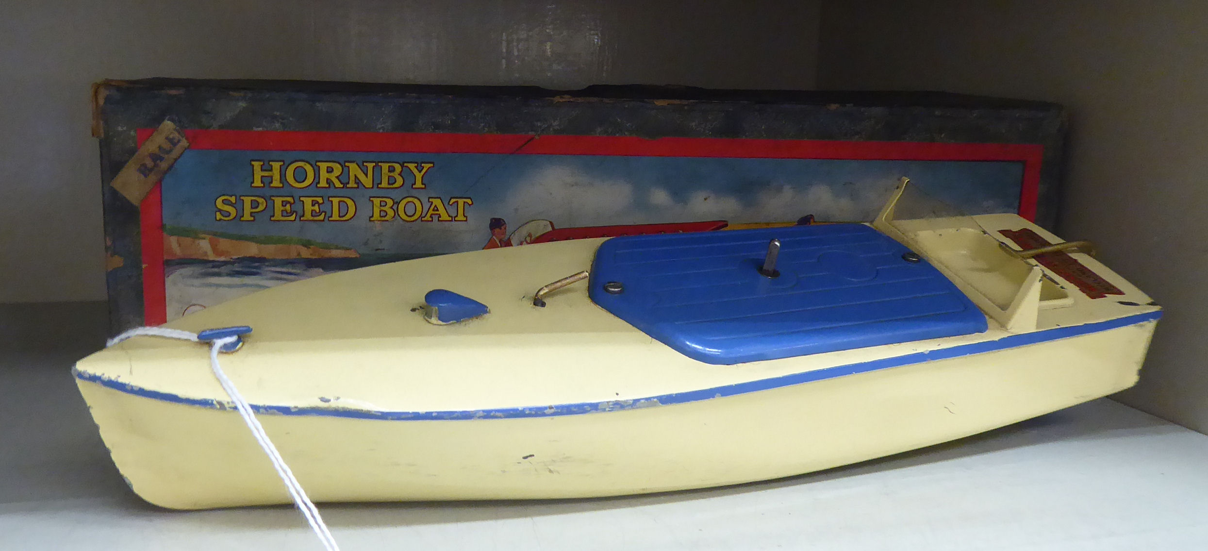 A Hornby clockwork model speed boat, in cream coloured and blue livery 12.