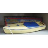 A Hornby clockwork model speed boat, in cream coloured and blue livery 12.