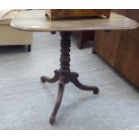 A George III mahogany pedestal table, the tip-top with round corners, over a ring turned column,