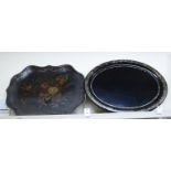 A late Victorian black lacquered and mother-of-pearl inlaid oval papier mache tray,