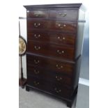 An early 19thC mahogany chest-on-chest, the two short/six long drawers with cast brass bail handles,